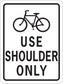 Road sign sticker with bicycle icon and text “USE SHOULDER ONLY”