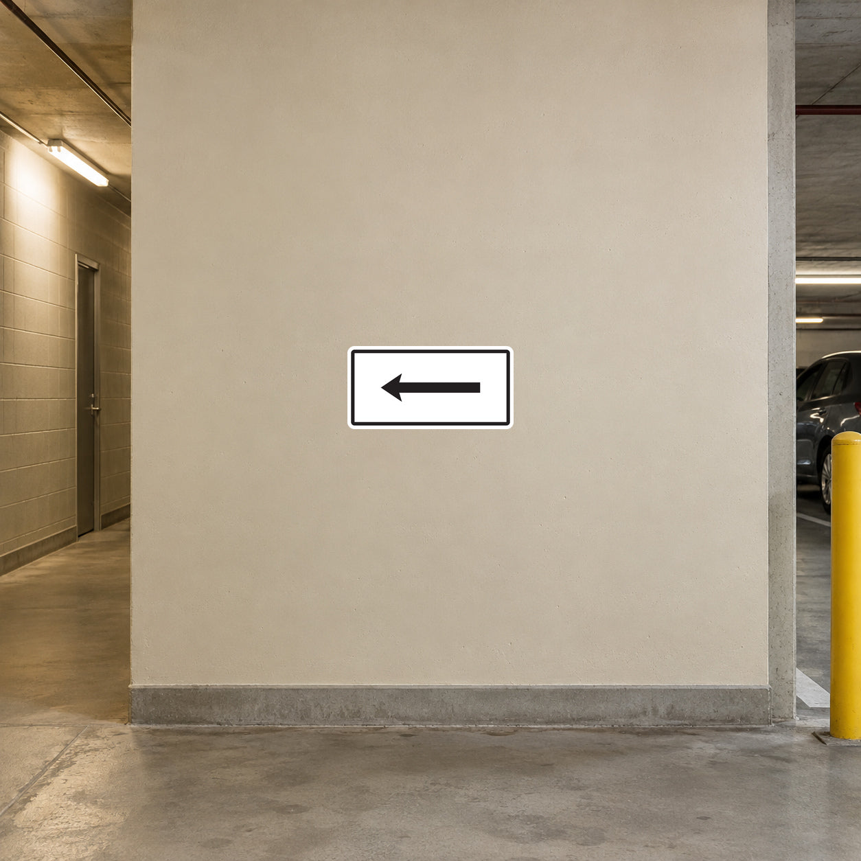 Road sign sticker with black left arrow in white rectangular border