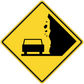 Road sign sticker: yellow diamond warning sign with black border and damaged car