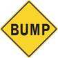 Yellow road sign sticker with black border and BUMP text in a diamond shape