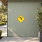 Road sign sticker with yellow diamond and black right-turn arrow