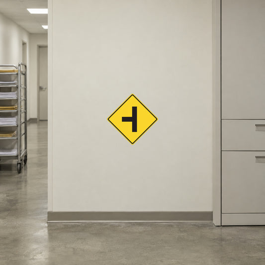 Road sign sticker with yellow diamond and black left arrow symbol