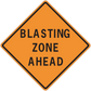 Orange road sign sticker with black border reading "BLASTING ZONE AHEAD"