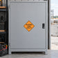 Road sign sticker with yellow diamond "BLASTING ZONE 1000 FT" on dark gray surface