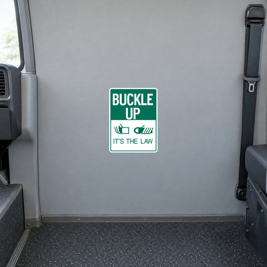 Square road sign sticker with green border and text “BUCKLE UP” and “IT'S THE LAW”