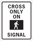 Road sign sticker with 'CROSS ONLY ON SIGNAL' text and crossing person icon