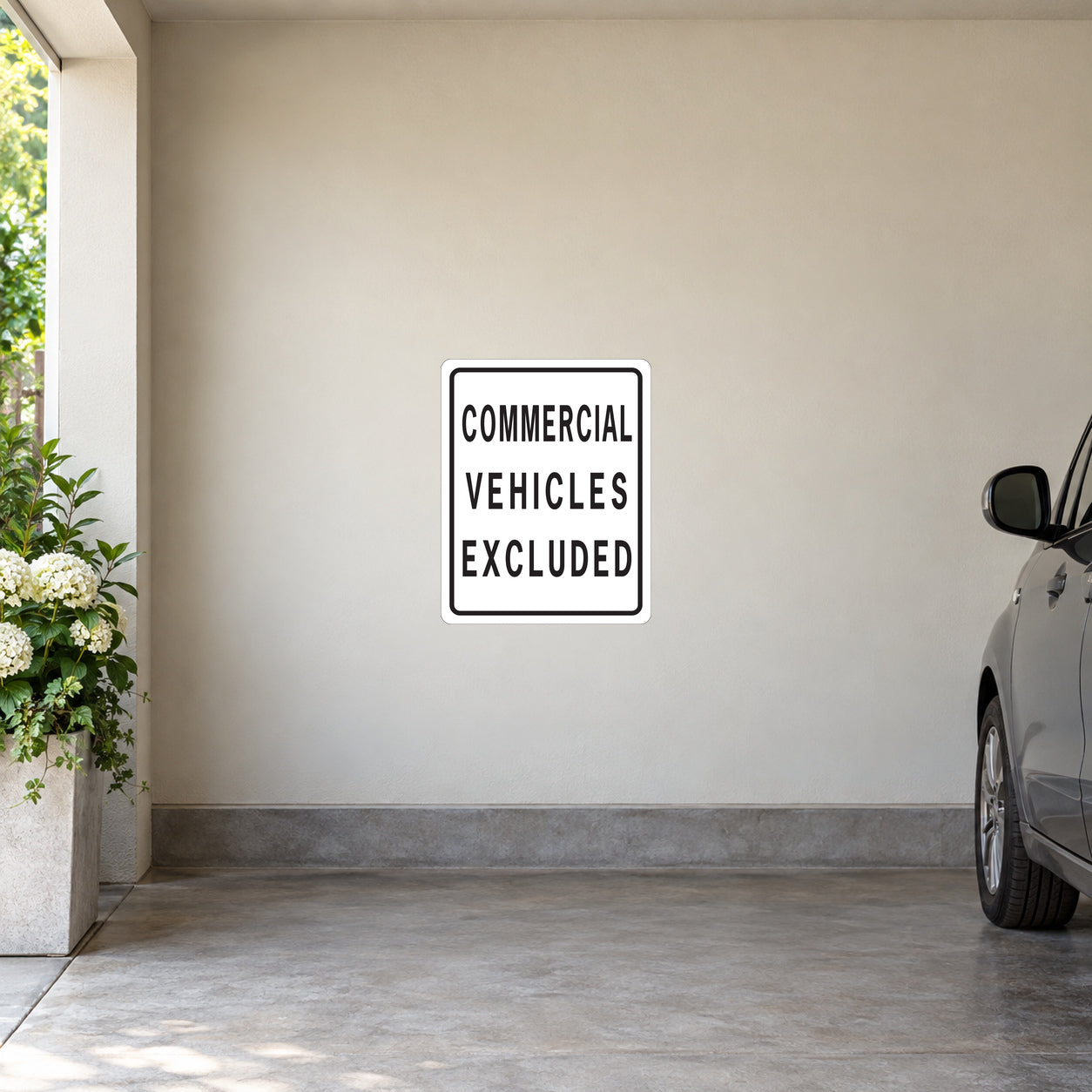 Road sign sticker: white square with 'COMMERCIAL VEHICLES EXCLUDED' text