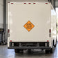 Road sign sticker with yellow diamond warning: DO NOT FOLLOW TRUCKS