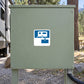 Road sign sticker with blue camper trailer icon on gray panel