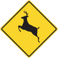 Yellow road sign sticker with black deer silhouette inside diamond