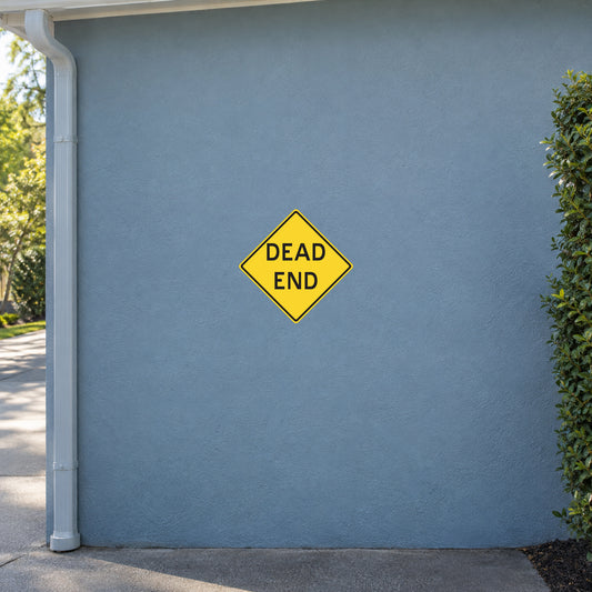 Yellow road sign sticker with black border, diamond shape, text "DEAD END"