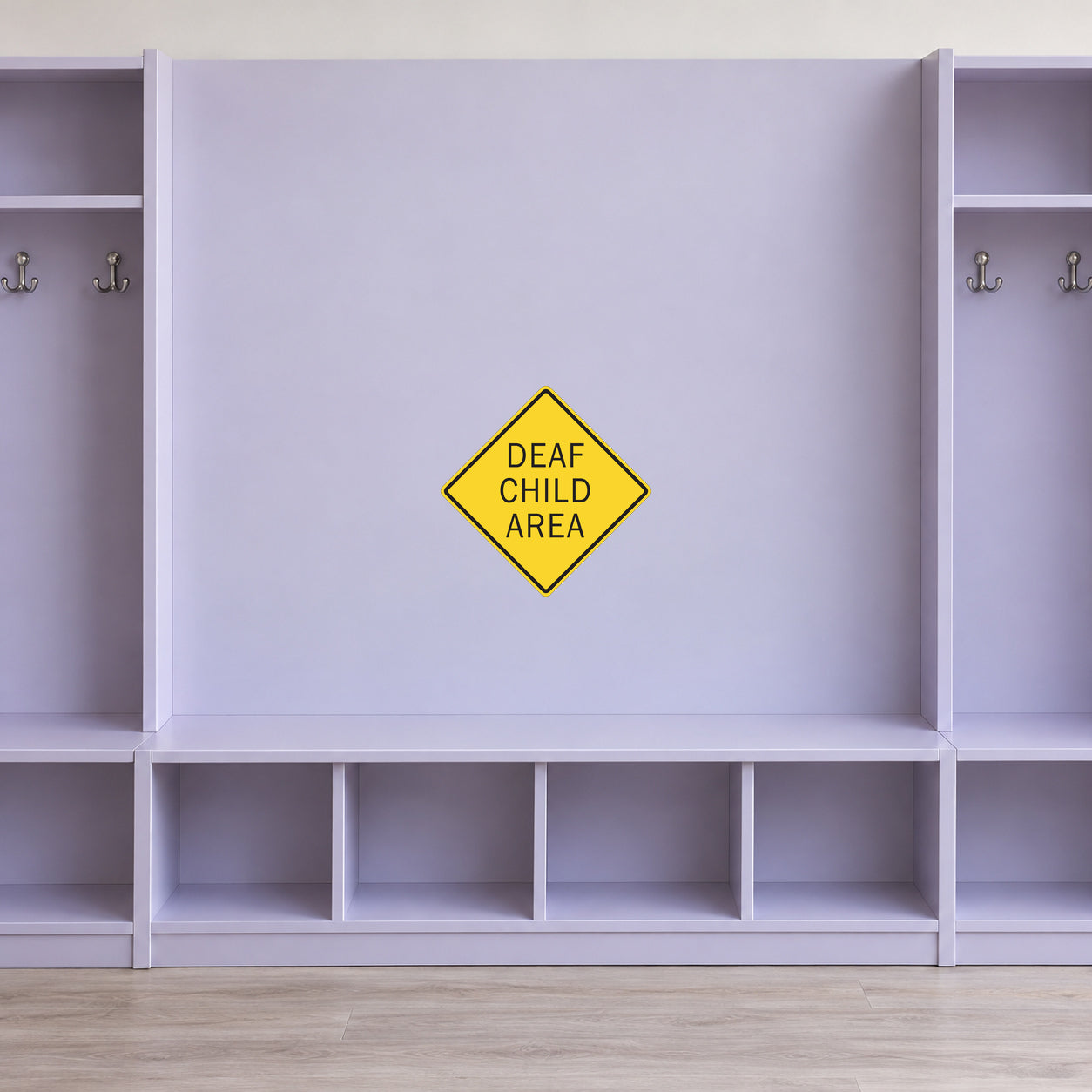 Road sign sticker featuring a yellow diamond sign with “DEAF CHILD AREA” text