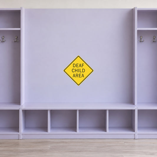 Road sign sticker featuring a yellow diamond sign with “DEAF CHILD AREA” text
