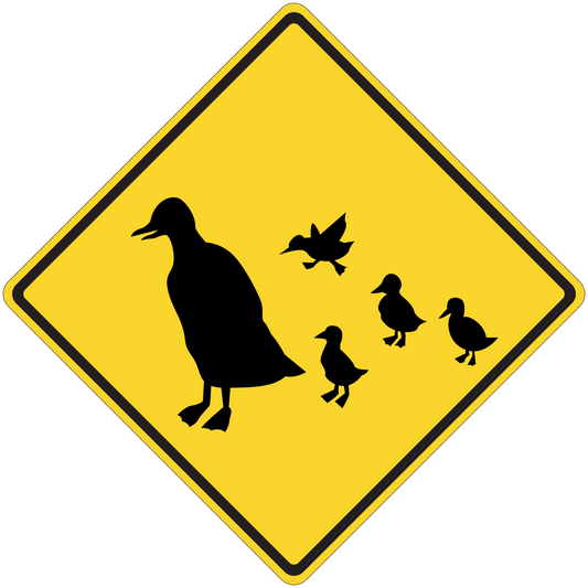 Yellow road sign sticker with black birds silhouettes