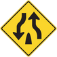 Yellow road sign sticker with black arrows pointing up and down in a diamond