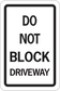 Road sign sticker with bold text: “DO NOT BLOCK DRIVEWAY”