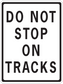 Road sign sticker with "DO NOT STOP ON TRUCKS" warning text
