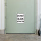 Road sign sticker: 'DO NOT BLOCK INTERSECTION' warning