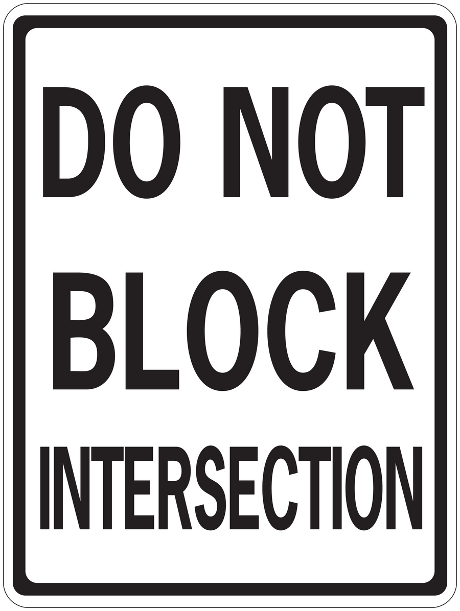 Road sign sticker with bold black text: DO NOT BLOCK INTERSECTION