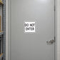 Do Not Enter road sign sticker with black text in a white bordered square
