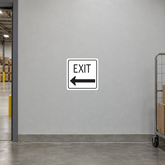 Road Sign Sticker applied in A light grey warehouse exit corridor smooth wall with doorway at extreme left and parcel trolley far right, blank central surface