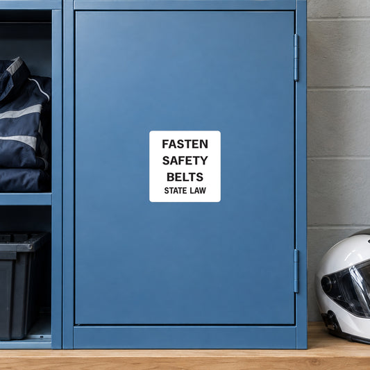 Road Sign Sticker applied in A muted blue fleet crew room storage cabinet with folded driving jacket extreme left and helmet low right, blank single smooth door