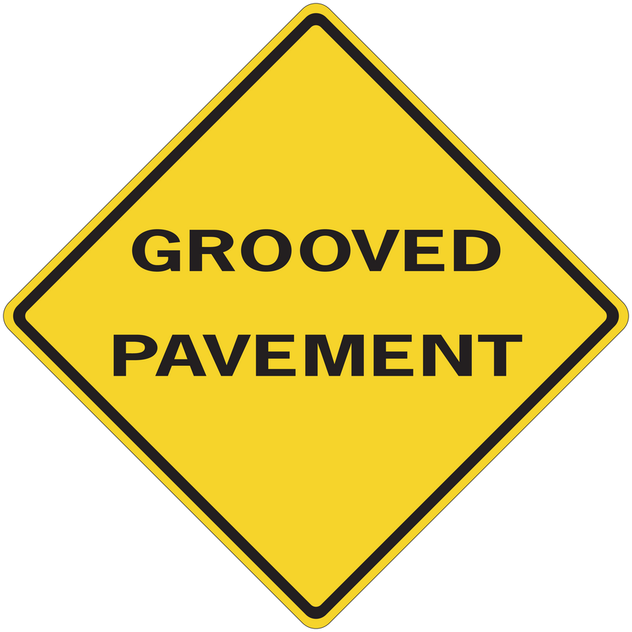 Road sign sticker with yellow diamond and text “GROOVED PAVEMENT”