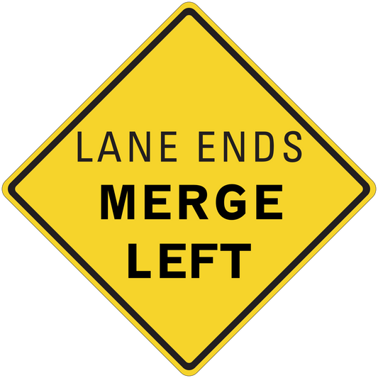 Yellow road sign sticker with diamond shape, black border, text 'LANE ENDS MERGE LEFT'.