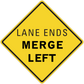 Yellow road sign sticker with diamond shape, black border, text 'LANE ENDS MERGE LEFT'.