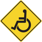 Yellow road sign sticker with black wheelchair accessibility symbol, diamond shape with border