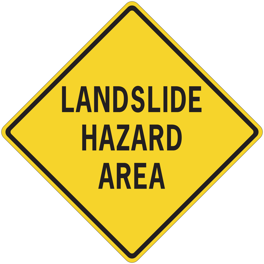 Yellow road sign sticker, black border diamond reading “LANDSLIDE HAZARD AREA”