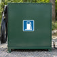 Road Sign Sticker applied in A private vehicle fueling service shed, smooth forest green cabinet door, coiled hose extreme left, gravel below