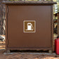 Brown road sign sticker with white gas pump icon inside a square border.