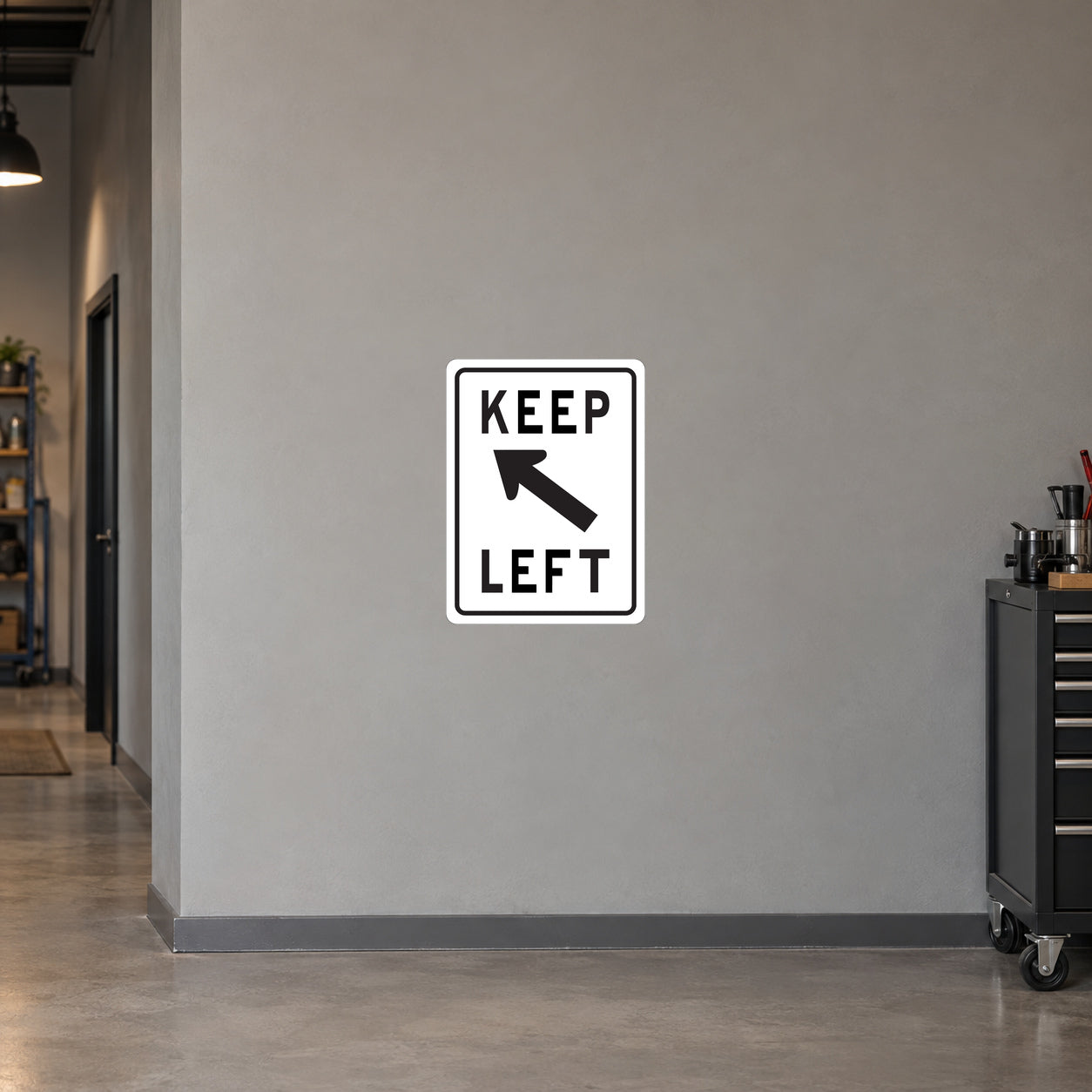 Road sign sticker with "KEEP LEFT" text and left-pointing arrow