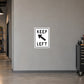 Road sign sticker with "KEEP LEFT" text and left-pointing arrow