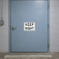 Road sign sticker with black text reading "KEEP RIGHT" inside a white border