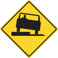 Road sign sticker: yellow diamond warning with black worker road machine icon