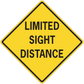 Road sign sticker: yellow diamond with black border, text “LIMITED SIGHT DISTANCE”