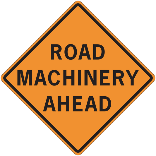 Road sign sticker with orange diamond border and text: ROAD MACHINERY AHEAD