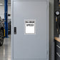 Road Sign Sticker applied in A vehicle testing garage, single smooth light grey cabinet door, tire gauge tool rack extreme right