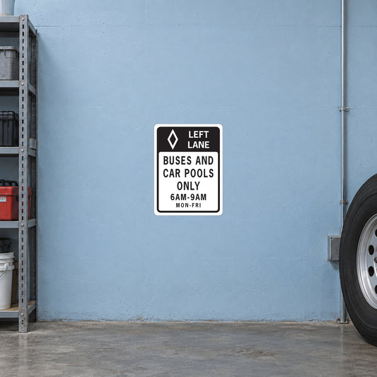 Road sign sticker, white with black border and text: LEFT LANE BUSES AND CAR POOLS ONLY