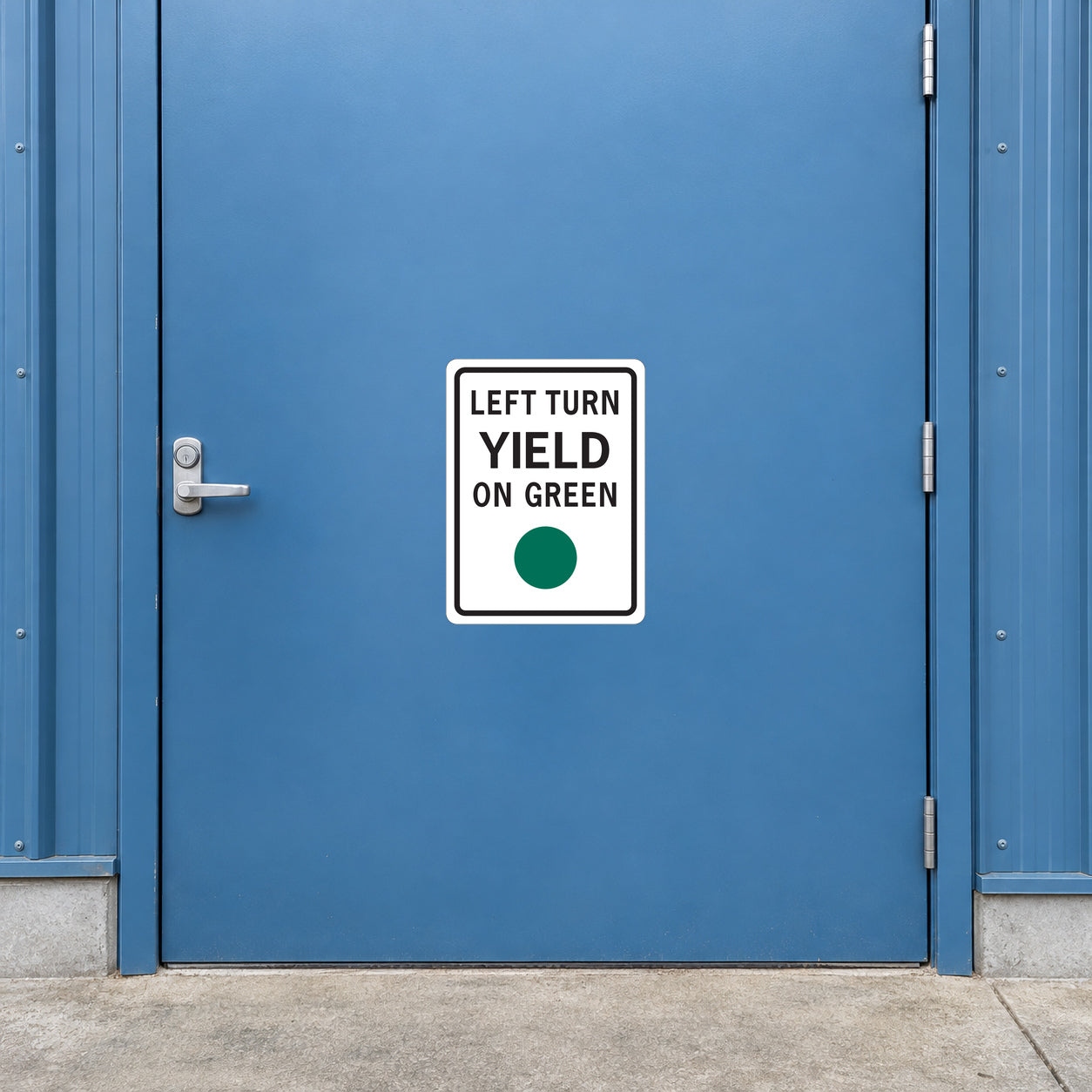 Road sign sticker with 'LEFT TURN YIELD ON GREEN' and green dot