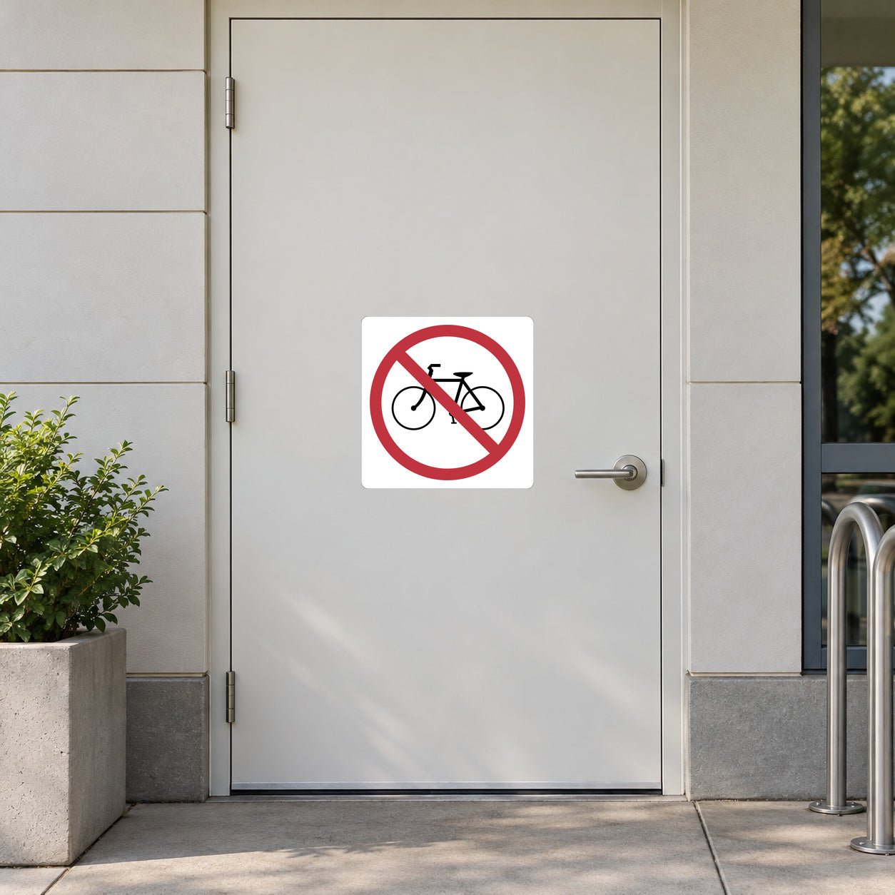 Road Sign Sticker applied in A pedestrian recreation building entrance, smooth warm white steel door, bicycle rack only at extreme right