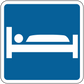 Road sign sticker: blue square with white car icon and thin white border