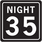 Road sign sticker with white border, 'NIGHT 35' text on dark background