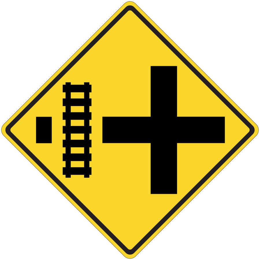 Yellow road sign sticker with black cross and vertical measurement marks