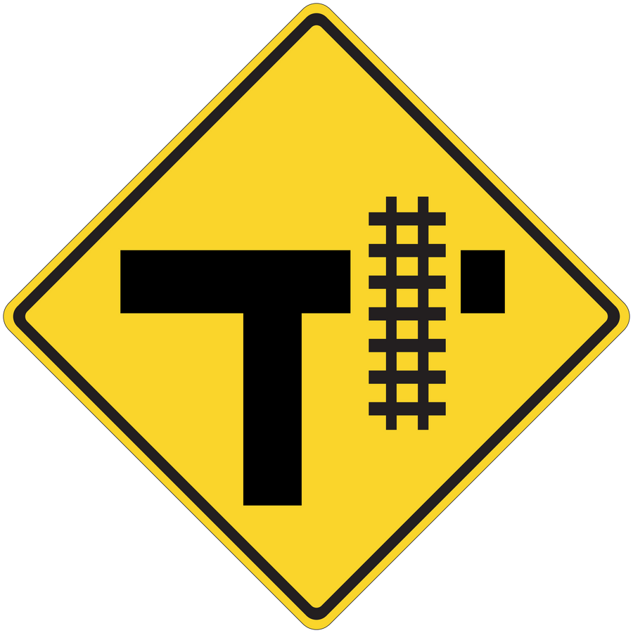 Yellow road sign sticker with black T and rail-crossing symbol