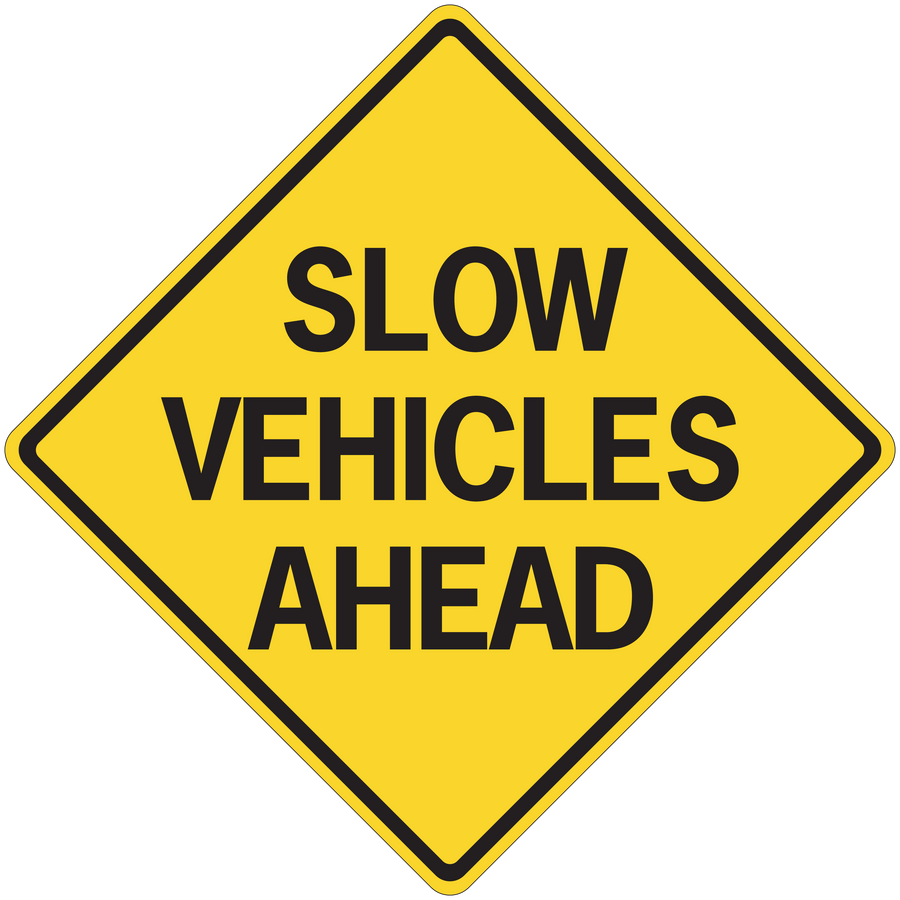 Road sign sticker with yellow diamond and text SLOW VEHICLES AHEAD