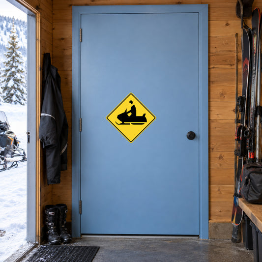 Yellow road warning sign sticker on blue door