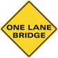 Yellow road sign sticker with "ONE LANE BRIDGE" text in black